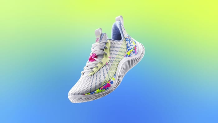 View of white and blue Under Armour shoe.